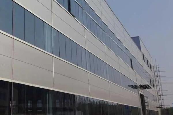 What are the functions of aluminum veneer curtain walls?